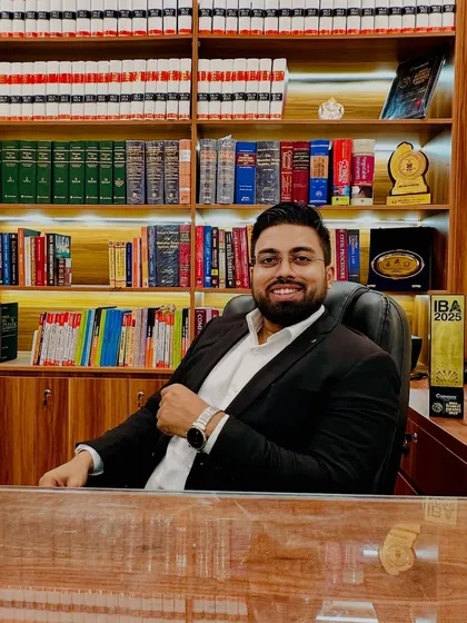 In my office, surrounded by law books, where I strategize and prepare for your cases. My goal is to provide you with clear, straightforward advice for your property matters.