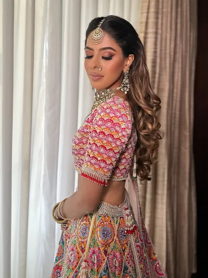 Another beautiful shot of Anjali. The makeup is fresh and vibrant, perfect for a day event.
