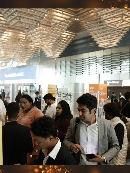 The entrance to the exhibition hall is filled with an electrifying energy as thousands of attendees arrive, ready to explore.
