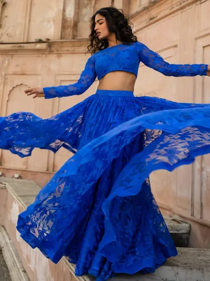 Another look at our royal blue lace lehenga. The quality, fit, and flare make it a smart and sustainable choice for any event.