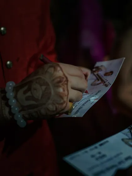 Signing autographs for fans after the Ahmedabad show. The personal connection with the audience is something I deeply cherish.