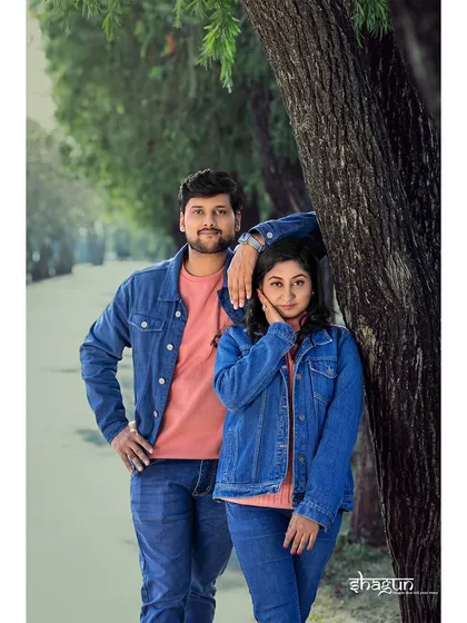 A cool, relaxed pose against a tree. The matching denim jackets and their easy-going expressions give this shot a very natural and contemporary feel.