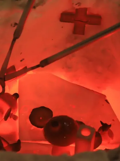 A look inside the Raku kiln as it reaches over 1000 degrees Celsius. The pieces glow red-hot, just moments before being removed for the post-firing reduction process.