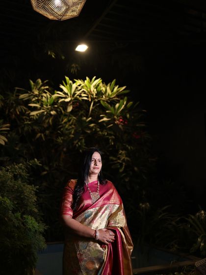 Another powerful shot of the mother of the groom. Her regal posture and the rich textile of her saree showcase the quiet luxury and elegance we aim to bring to our clients.
