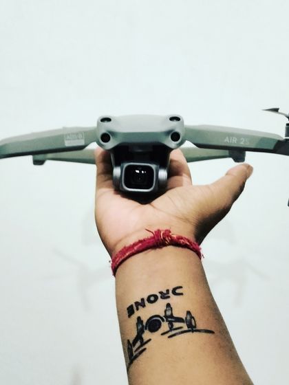 My passion for drones is more than just a job. I am holding my reliable DJI Air 2S, ready for the next flight.