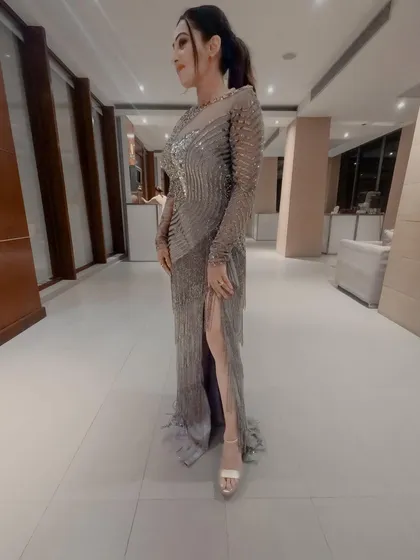 Another angle of the silver gown. The fringe details added beautiful movement, and the thigh-high slit made it easy to move around on stage.