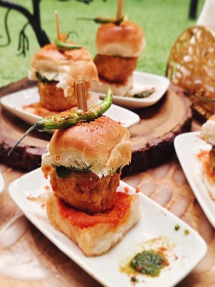 At first glance it looks like a vada pav, but we've added our own special twist. This appetizer features a crispy jackfruit fritter in a soft bun, delivering a unique and satisfying flavor profile that surprises and delights.