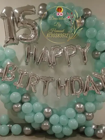 A simple and elegant 15th birthday decoration. I used a full ring of mint green and silver balloons, with large foil letters and numbers to highlight the "Happy 15th Birthday" message.