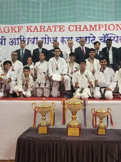 The victorious RTKA team at the 8th AGKF Karate Championship. The trophies and medals are a testament to the collective effort and skill of our students and instructors.
