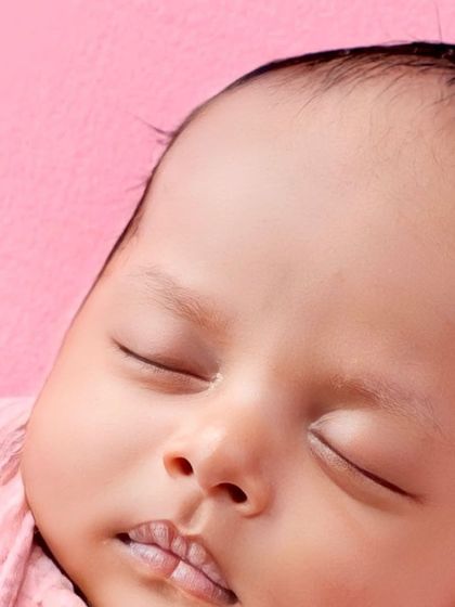 A macro close-up of the baby's face, showing every perfect detail.
