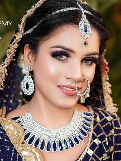 A bride in a blue sequin lehenga wearing a matching sapphire-blue American Diamond set. This is a perfect example of color-coordinated modern bridal jewellery.