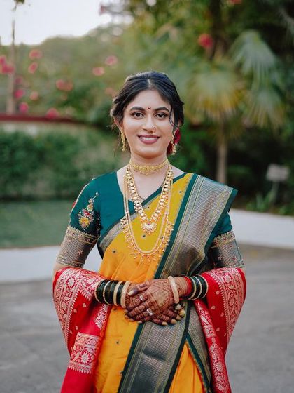 A full-length view of the bride's stunning look. The makeup is designed to last through the day's ceremonies while keeping her looking fresh and beautiful.
