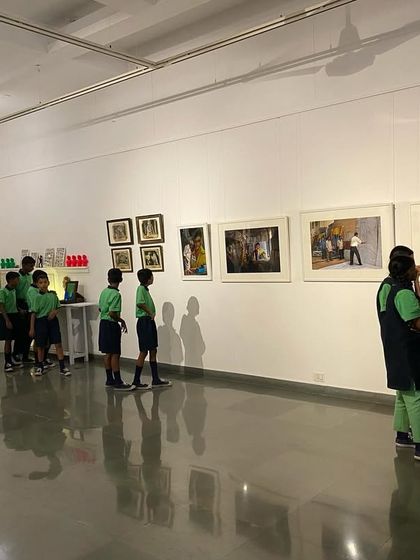 The students from Parikrma observing the artworks lining the gallery walls.