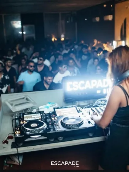 My view from the console, looking out at a sea of people lost in the music. Keeping the dance floor packed and the energy high is what I do best, whether it's an underground rave or a peak-hour club night.