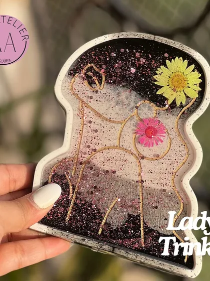This beautiful lady trinket dish was part of a custom Rakhi hamper for a sister. It's perfect for holding jewelry and adds an artistic touch to any dresser.