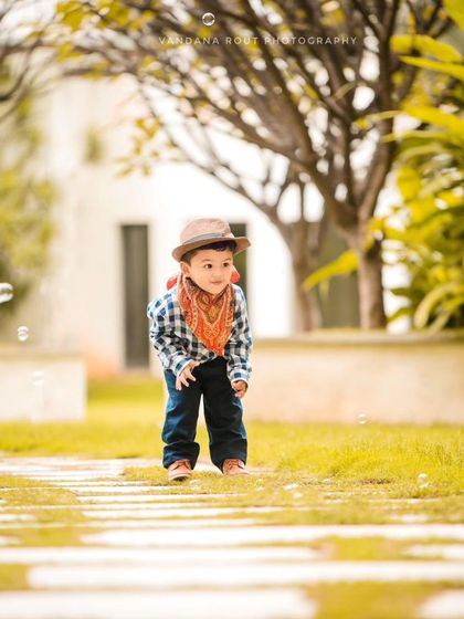 Another shot of the little cowboy watching bubbles. The soft, golden light of the late afternoon adds a warm and dreamy quality to this outdoor portrait.