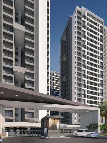 The main entrance view for the Regency Astra project in Pune. The design of the gate and the flanking towers establishes a strong sense of arrival and introduces the modern architectural language of the development.