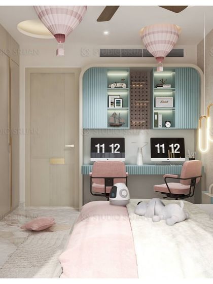 This view shows the dual-station study area in the kids' room, with custom-built desks and shelving, making it a perfect space for siblings.