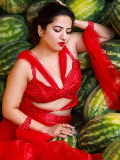 A creative and vibrant summer-themed shoot with an actress in a red outfit surrounded by watermelons. This series is playful and colorful, perfect for a brand campaign or a unique portfolio piece.