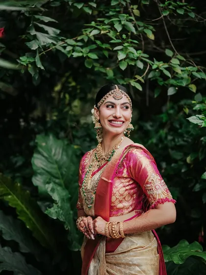 A beautiful bridal portrait taken amidst the giant leaves of our tropical plants. The natural setting provides a stunning and unique backdrop.