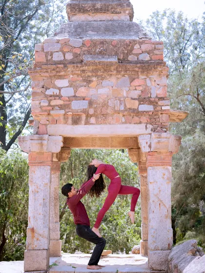 Acroyoga is more than just poses; it's an exercise in trust and communication. In my team-building workshops, I guide partners through foundational lifts like this, creating a unique and memorable bonding experience.