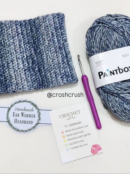 A stretchy and soft crochet headband or ear warmer, made with beautiful blue variegated yarn.