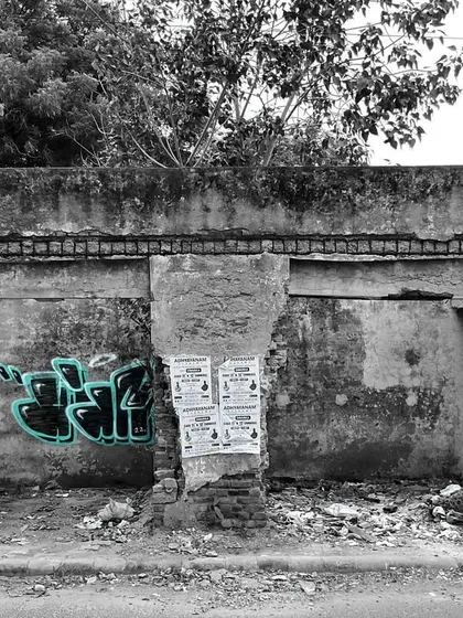 The full context of the abandoned spot. Finding these forgotten places is part of the adventure. They are perfect canvases where I can paint freely without judgment, just me and the wall.