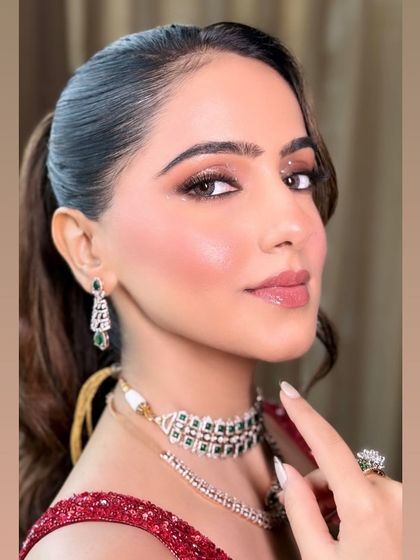 A close-up shot focusing on the eye makeup and the flawless skin finish.