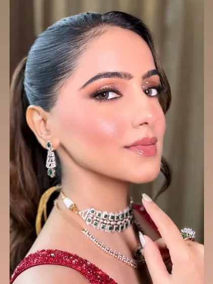 A close-up shot focusing on the eye makeup and the flawless skin finish.