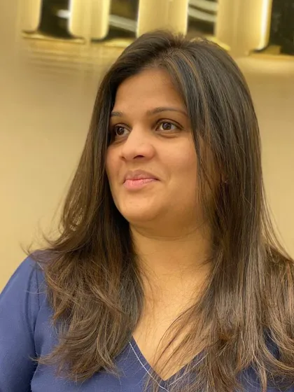 A client with her new layered haircut, a look that is both stylish and easy to maintain.