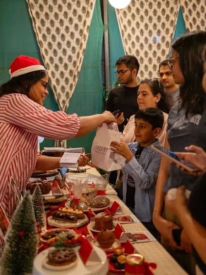 For us, it's all about community. This moment from a Christmas pop-up, sharing a treat with a young customer, captures the joy and personal connection that is at the heart of Maska Bakery. We love meeting you and being part of your celebrations.