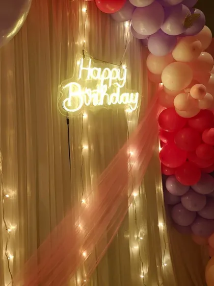A close-up of the 'Happy Birthday' neon sign, which adds a modern and stylish touch to any celebration.
