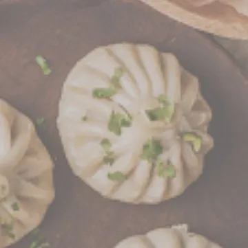 A perfectly steamed and pleated momo, ready to be served. Our chefs can prepare a variety of Continental and Asian appetizers, perfect for starting any party.