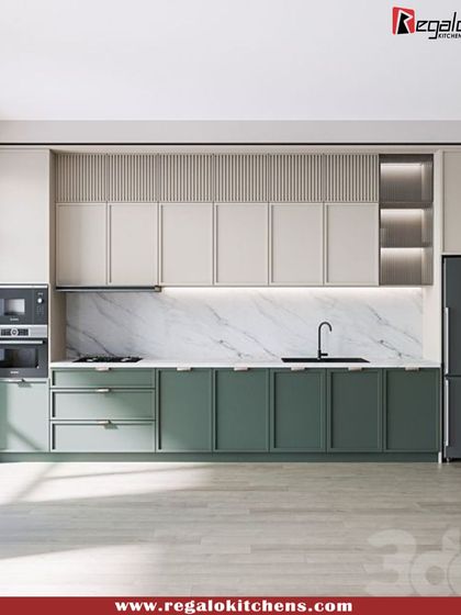 This kitchen design showcases a beautiful blend of materials. We used a soft green for the base cabinets, a fluted texture for the uppers, and a white marble backsplash. The integrated double oven and fridge complete the seamless, modern look.