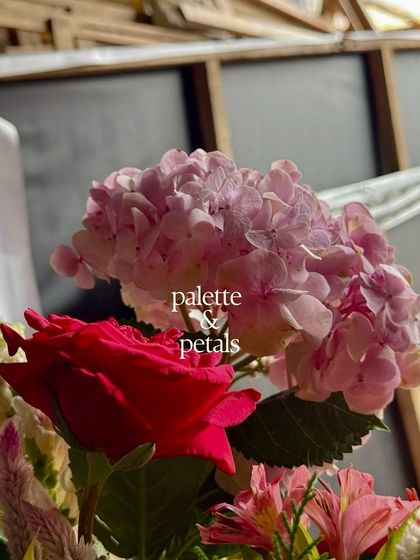 A close-up of a pink hydrangea and a red rose. This is where our ideas take shape, through petals, textures, and colors, as we explore new combinations for our floral storytelling.