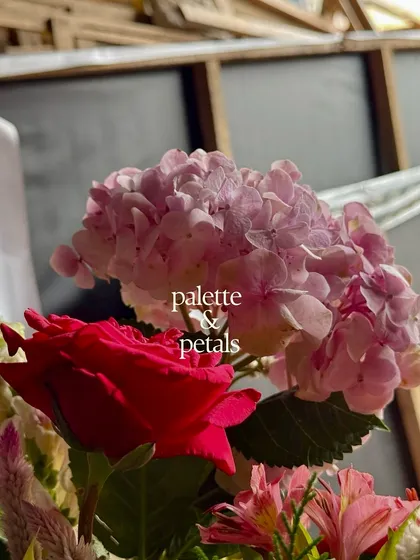 A close-up of a pink hydrangea and a red rose. This is where our ideas take shape, through petals, textures, and colors, as we explore new combinations for our floral storytelling.