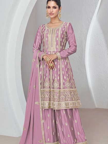 I love this onion pink Chinon silk palazzo suit for its soft, feminine vibe. The heavy thread and sequin work on the top makes it a standout piece for any festive occasion.