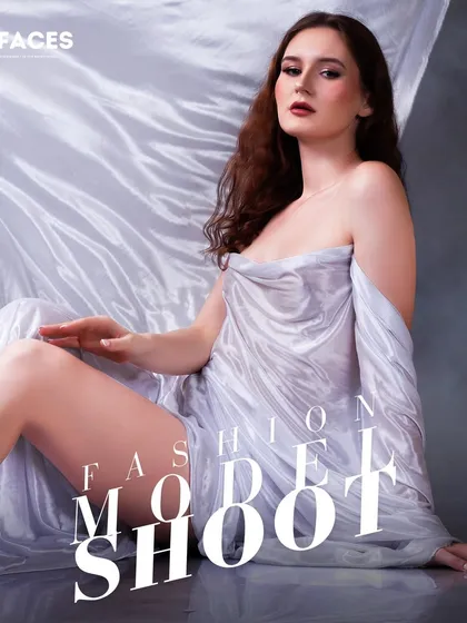 An artistic shot of a model draped in flowing white fabric. This conceptual image is perfect for a high-fashion editorial or a brand looking to create a unique and memorable visual.