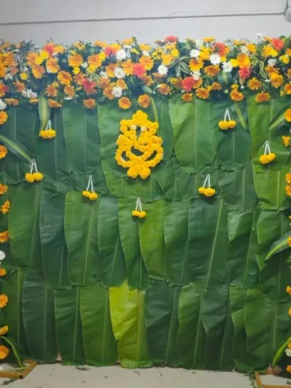 A clear, straight-on view of the banana leaf and floral backdrop. This versatile design is perfect for Haldi, baby showers, or any traditional pooja ceremony.