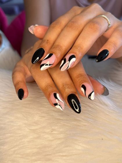 Another shot of the striking black and white abstract swirl nails.