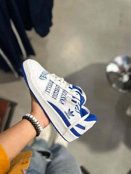 A simple but effective custom on a pair of Adidas Forums, with a blue zebra-like pattern.