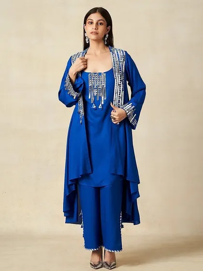 A chic, modern ethnic look for Gulabo by Abu Sandeep. The makeup is fresh and luminous, paired with statement silver earrings.