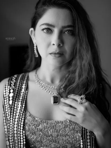 A classic black and white headshot that emphasizes expression and character. This type of timeless portrait is ideal for professional portfolios where a strong, focused look is needed.