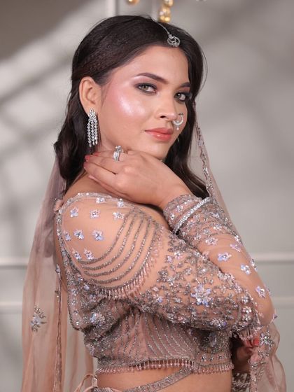 Client Sakshi, glowing with grace for her engagement. This look was all about enhancing her natural beauty with soft, radiant, and bridal-ready makeup.