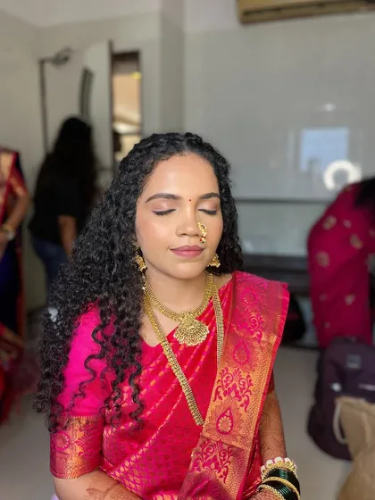 Another angle of this beautiful 'makeup that looks like skin' look. Her complexion is even and glowing, showing how a minimal approach can have a stunning impact.