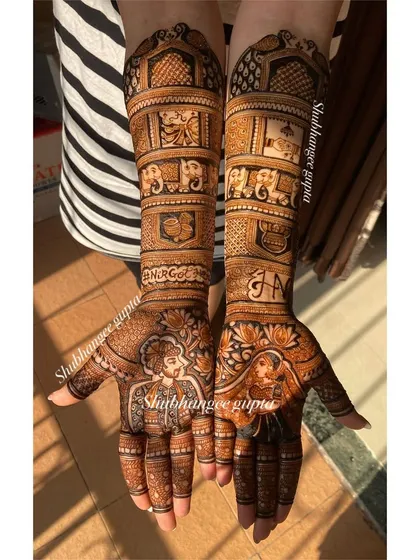 This stunning bridal design features detailed portraits of the bride and groom on each palm. The surrounding patterns are filled with lotus flowers and traditional motifs.