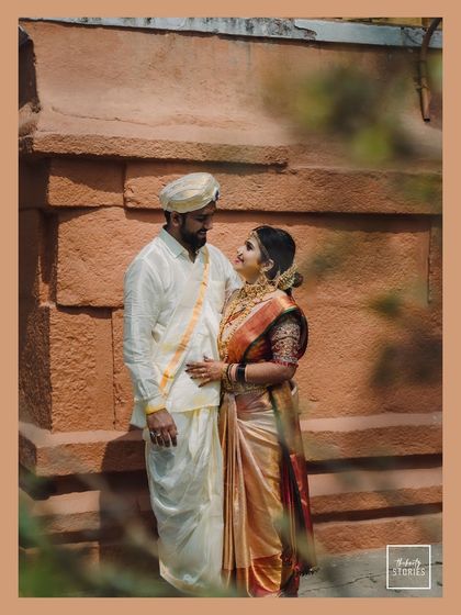 A quiet look of love shared against the warm tones of a heritage wall. These are the unposed, heartfelt moments I aim to capture, reflecting your genuine connection.