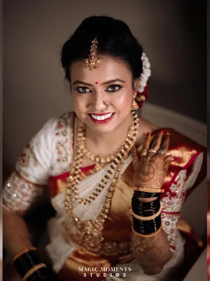A bright and happy bridal portrait. Lavanya's smile lights up the frame, capturing the joy of her wedding day.