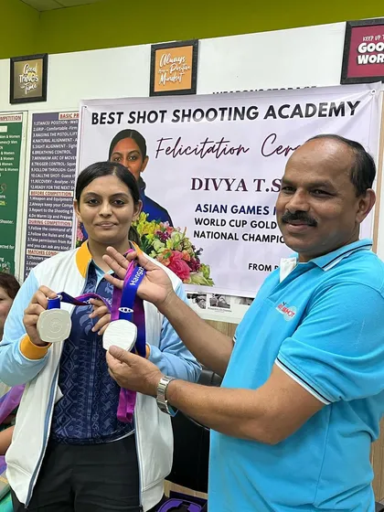 Presenting the Asian Games silver medals to Divya T.S. at her felicitation ceremony.
