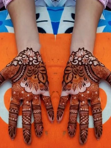 This symmetrical design features a large lotus motif on the back of each hand, a symbol of purity and beauty.